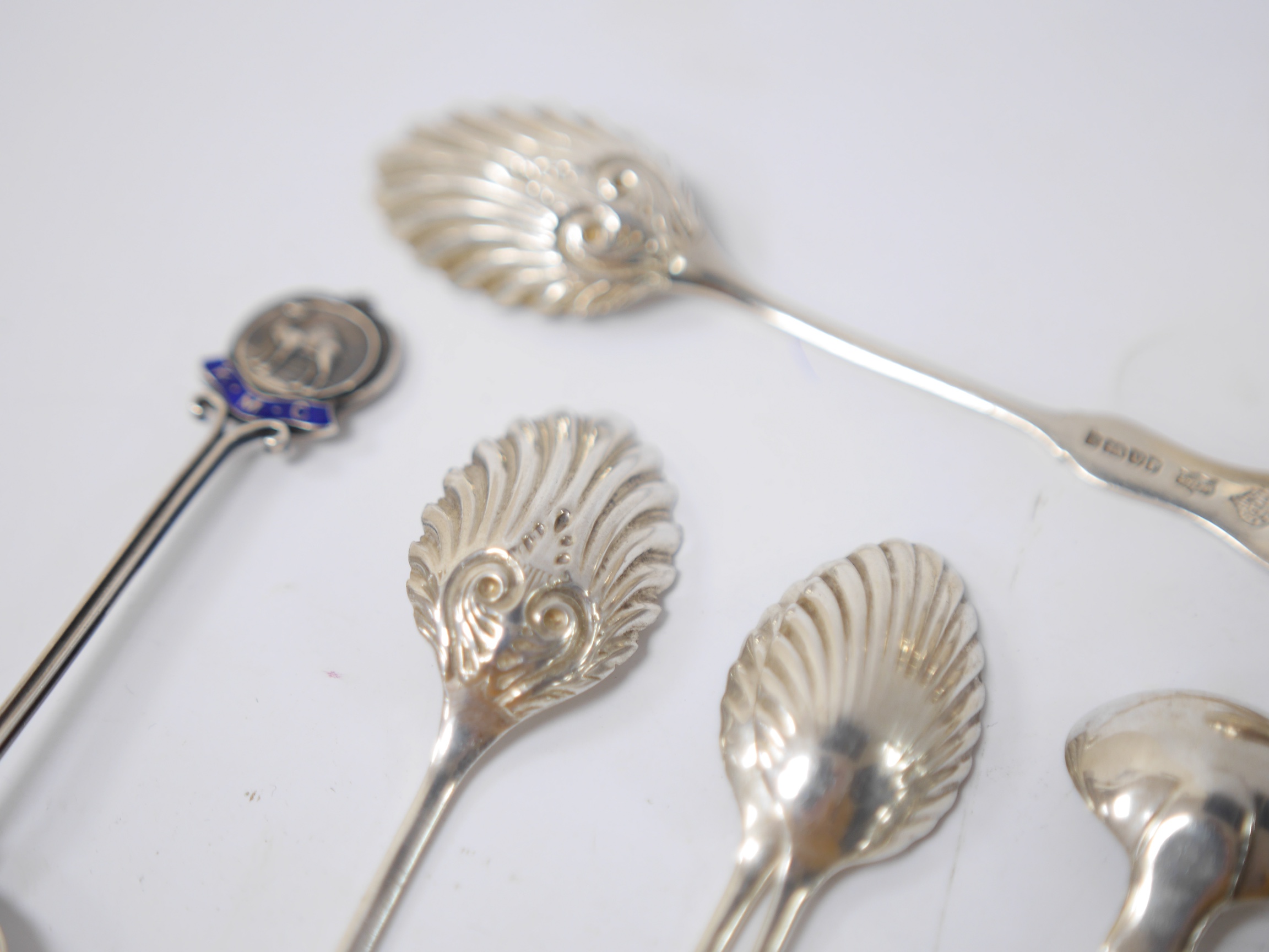 A quantity of assorted mainly 19th century and later silver flatware, including two Queens pattern sauce ladles, seventeen teaspoons, six mustard ladles, a toddy ladle, etc, and a silver pencil holder, various dates and